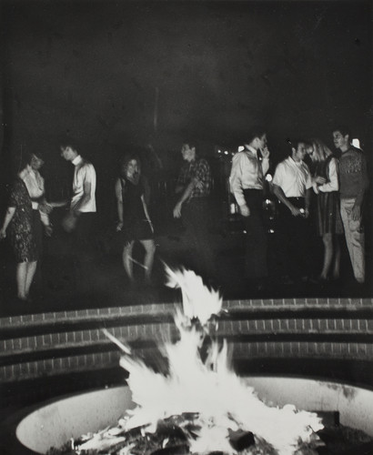 Students gathered around the fire pit, 1968