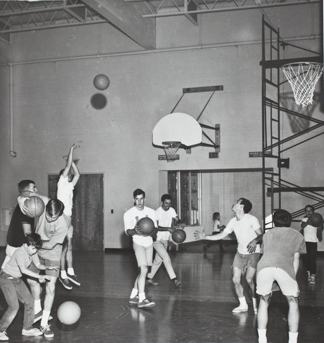 Circle K, service club, with Le Roy youngsters for pre-game basketball practice, 1968-69