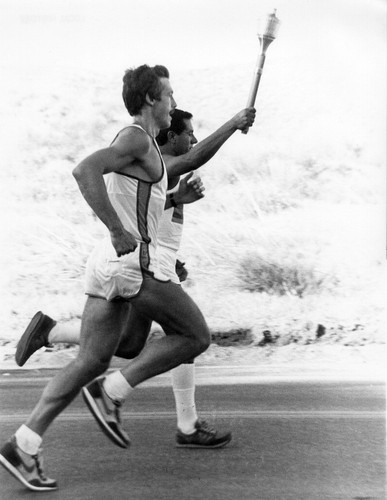 Anthony Revilla carrying the Olympic torch