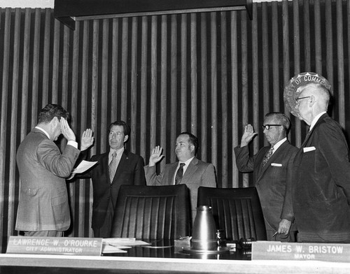 City administrator administering oath to the new City Council members