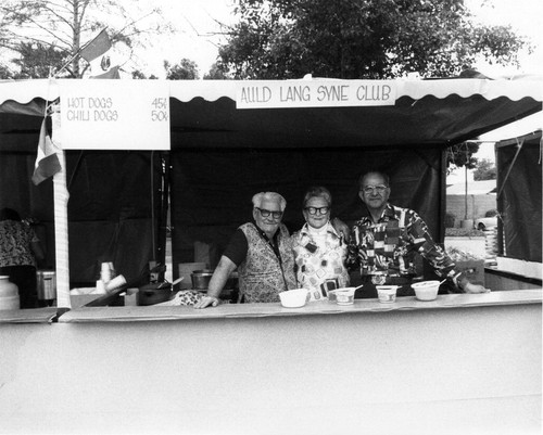 Senior citizens at the Auld Lang Syne Club booth