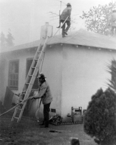 Firefighters extinguishing ire Commerce
