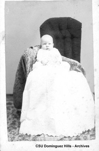 Baby in long white gown