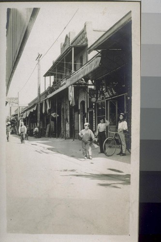 [Children in alley in Japanese commercial district, Fresno, California.]