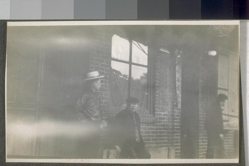 Chinatown, Los Angeles. 1911. [Men in front of unidentified building.]