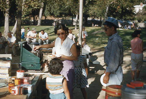 Woman, man, and young girls at Little Miss picnic