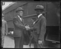 Robert A. Millikan greeted at a train station, Los Angeles, 1920-1939