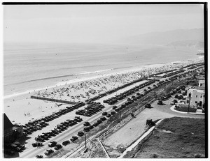 Birdseye view of a crowded beach along Pacific Coast Highway between Malibu and Santa Monica