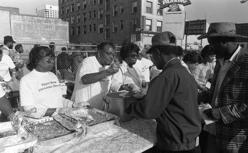 Upper Room Christian Church members serving food on Skid Row, Los Angeles, 1986