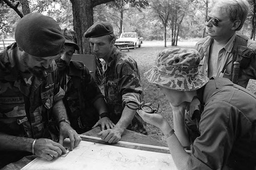 Survival school students look at a map, Liberal, 1982