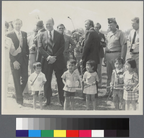 President Gerald Ford standing with children