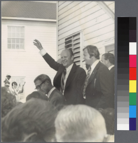 President Gerald Ford waving as he leaves a building