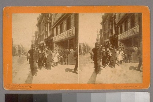 San Francisco, Cal. [Pedestrians, including Chinese, in front of signs advertising "Jo-Jo the Russian Dog Faced Boy" & "Unzie the White Hair Beauty"]
