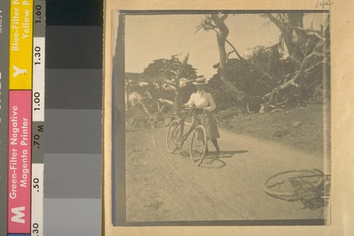 [Woman with bicycle]