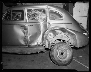 Wrecked 1937 Buick sedan at B&M Auto Works, 1340 South Olive Street, Los Angeles, CA, 1940