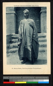 Chief standing before stairs, Burkina Faso, ca.1920-1940