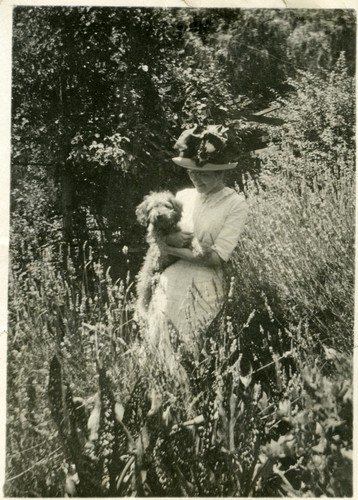 Florence Mabel Gates holding a pet dog