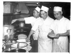 "Cooks at the Cherry Blossom Café in Los Angeles. Left to right: Fred Arzaga, Filipino; Fred Takeda, Nisei, and Bob Jung, Chinese. And they get along, too."--caption on photograph