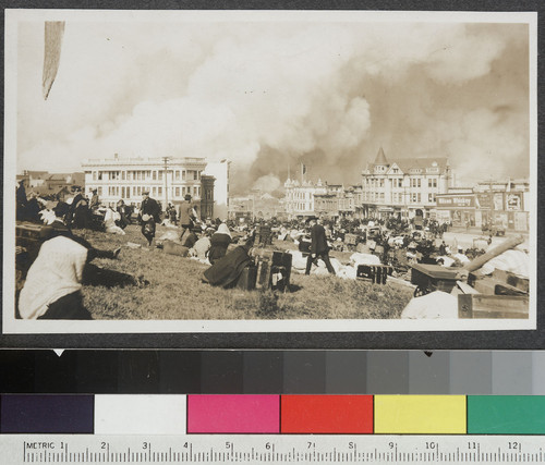 [Refugees in park near Market and Buchanan, with fires burning in distance.]