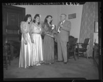 City council president George Moore with three contestants for queen of Philippines' independence day, Los Angeles, Calif., 1946