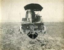 Knapp Heavy Ditching Plow attached to back of large tractor