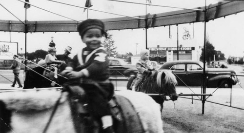 Mexican American boy on pony ride