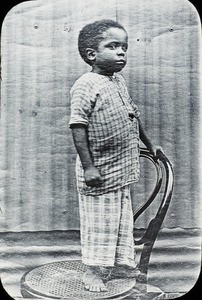 Young child on chair, Congo, ca. 1920-1930