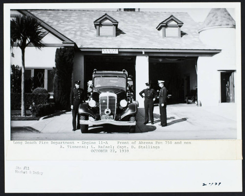 Firefighters standing with Engine 11-A in front of Station No. 11, Market Street and Dairy Avenue