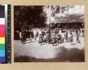 Children playing in front of teacher's house, Delena, Papua New Guinea, ca. 1905-1915