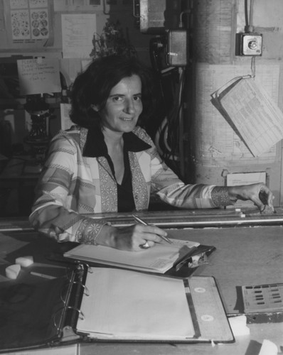 Scientist Miriam Kastner, specializing in geosciences and earth sciences, on board the D/V Glomar Challenger (ship) working on core samples from the Deep Sea Drilling Project. 1978
