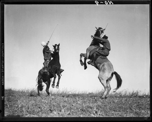 Boys fencing on horseback, Urban Military Academy, Brentwood, Los Angeles