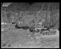 Penstocks and generators stand in the background at the rebuilding site of Power House #2, San Francisquito Canyon, 1928