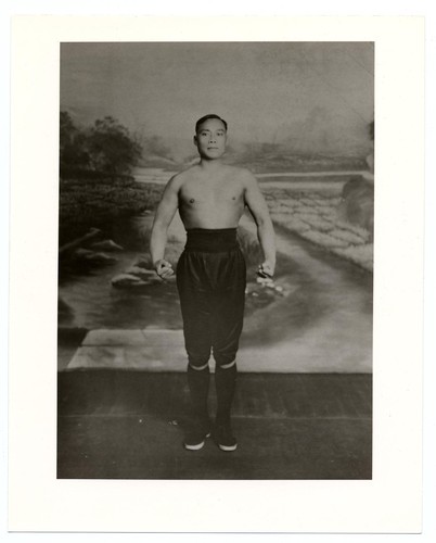 Portrait of a bare-chested actor posing on stage /