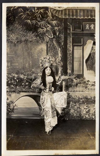 Holding a sword, a hero strikes a pose at the Great Star Theatre /