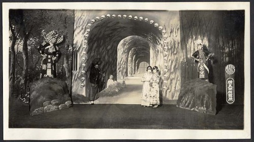 Two women in a dungeon, two heores on each side look on, staged at the Great Star Theatre /