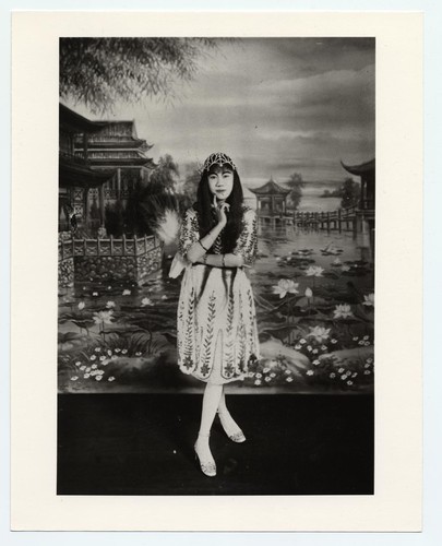 Actress in 1920s short skirt and high heeled shoes, and with wristwatch /