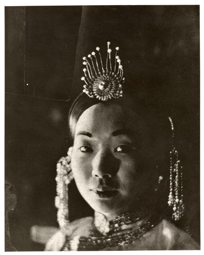 Unknown actress in a close-up wearing a headdress /