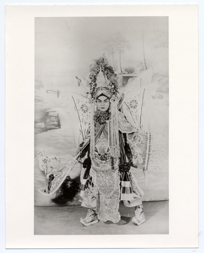 Actor in the role of a general, banners at his back denote his "troops" possibly at the Great Star Theatre /