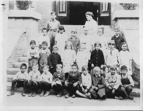 Photograph of classroom of children and teacher