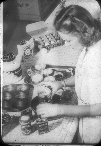 [Female student preparing muffins in foods class]