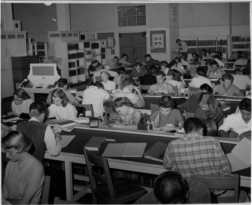 [Students studying in the library]