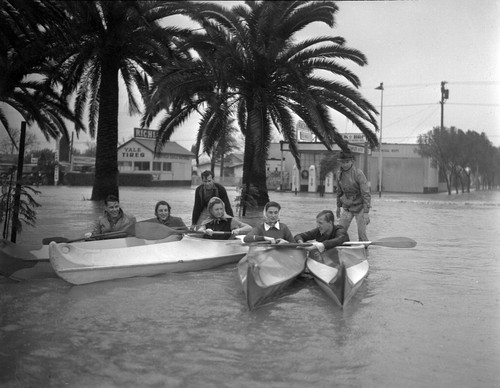 [Kayak Club posing in flood waters]