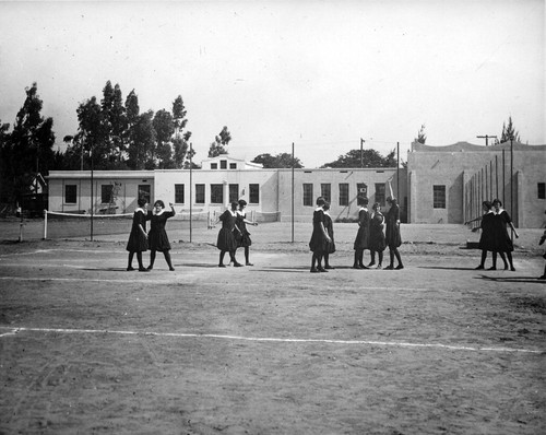 [Female students playing basketball]