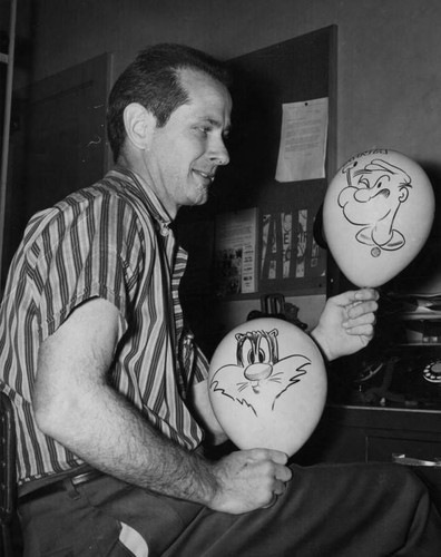 Gene Andreasen shows cartoon balloons he creates for Childrens Hospital