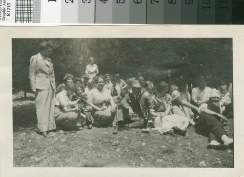 Leslie C. Brand sitting with friends and family at the lodge