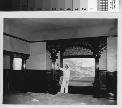 Workman painting the dining room alcove during the 1950s Brand Library renovation
