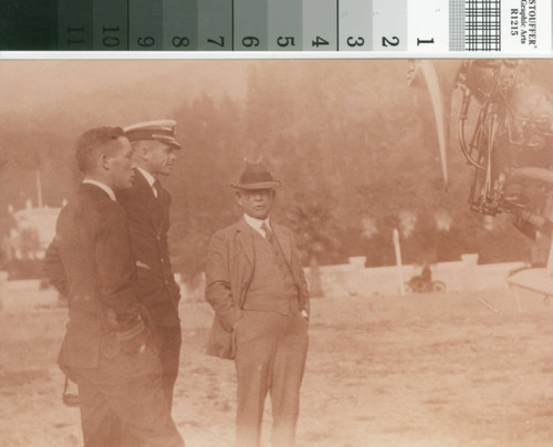 Leslie C. Brand and two pilots at fly-in party