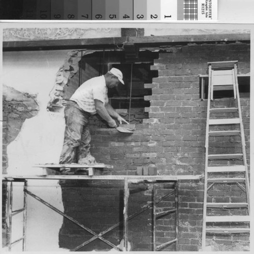 Workman laying brick during the 1950s Brand Library renovation