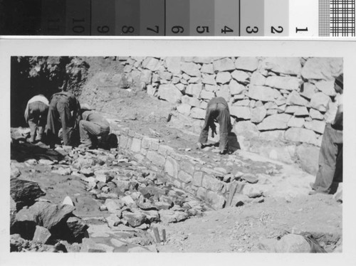 Laying masonry apron in front of large loose rock dam : Brand Park Project, Brand Park SP-30, Glendale, California, October 1935