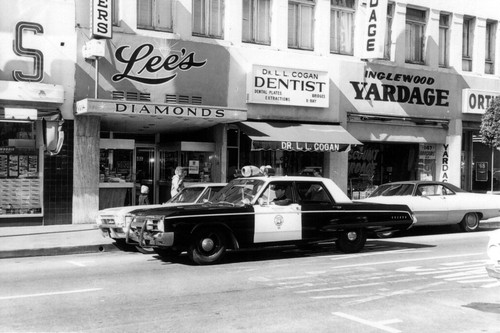 Inglewood Police Officer in patrol car